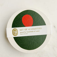 Pimento Olive: A set of paper coasters in pimento olive print.
