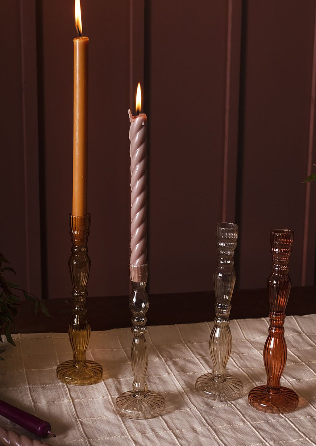 3: Assorted colors of optic glass candleholders with taper candles.