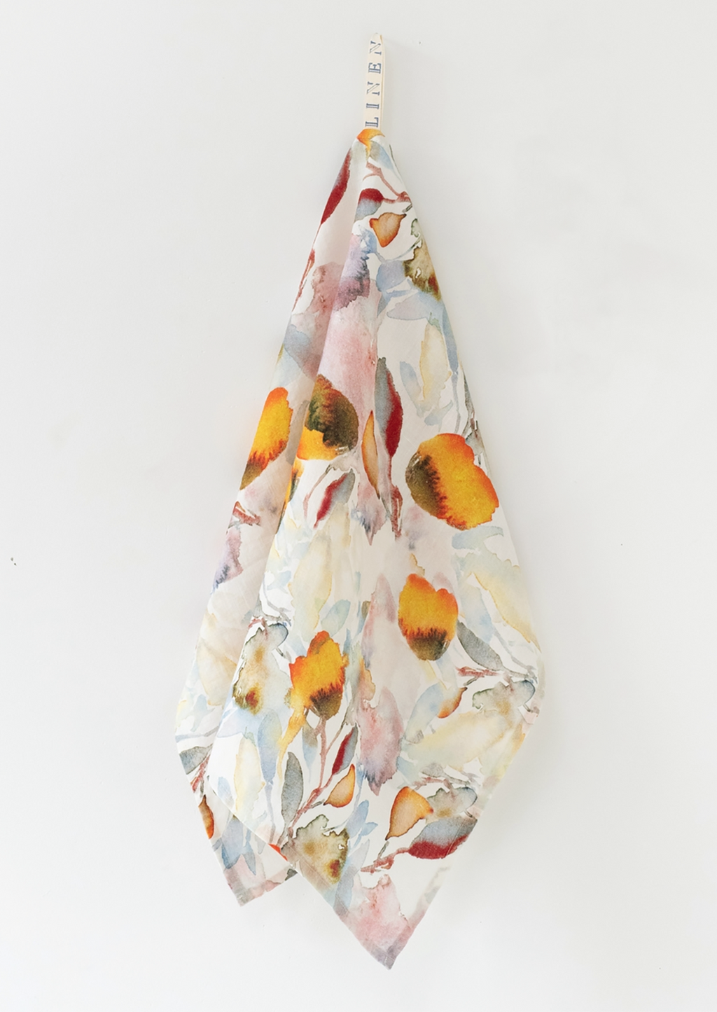 Orange Flow Multi: A botanical print tea towel in orange watercolor multi.