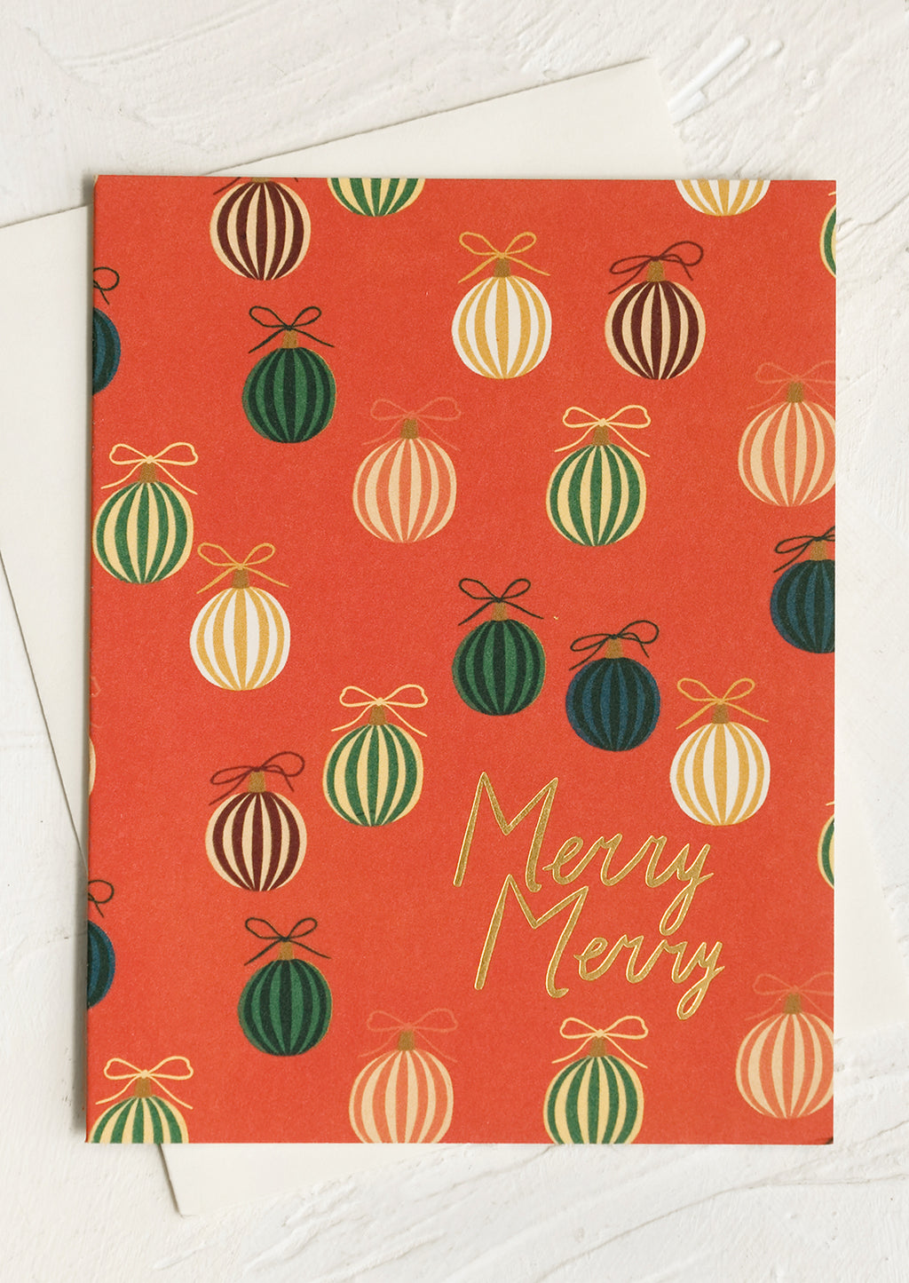 2: A set of red greeting cards with green ornament print, gold lettering reads "merry merry".