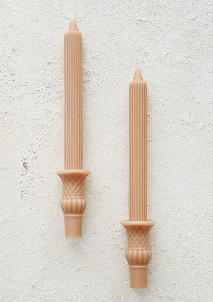 Nectar: A pair of urn shaped taper candles in nectar color.