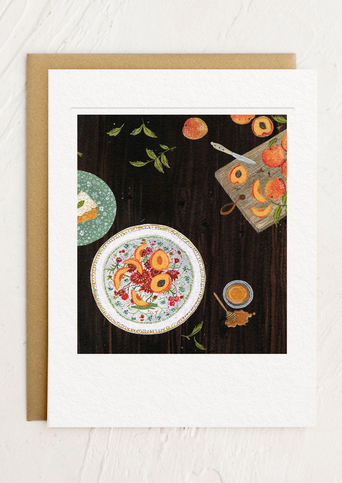 Card with artwork of a plate with fruit on a wooden table