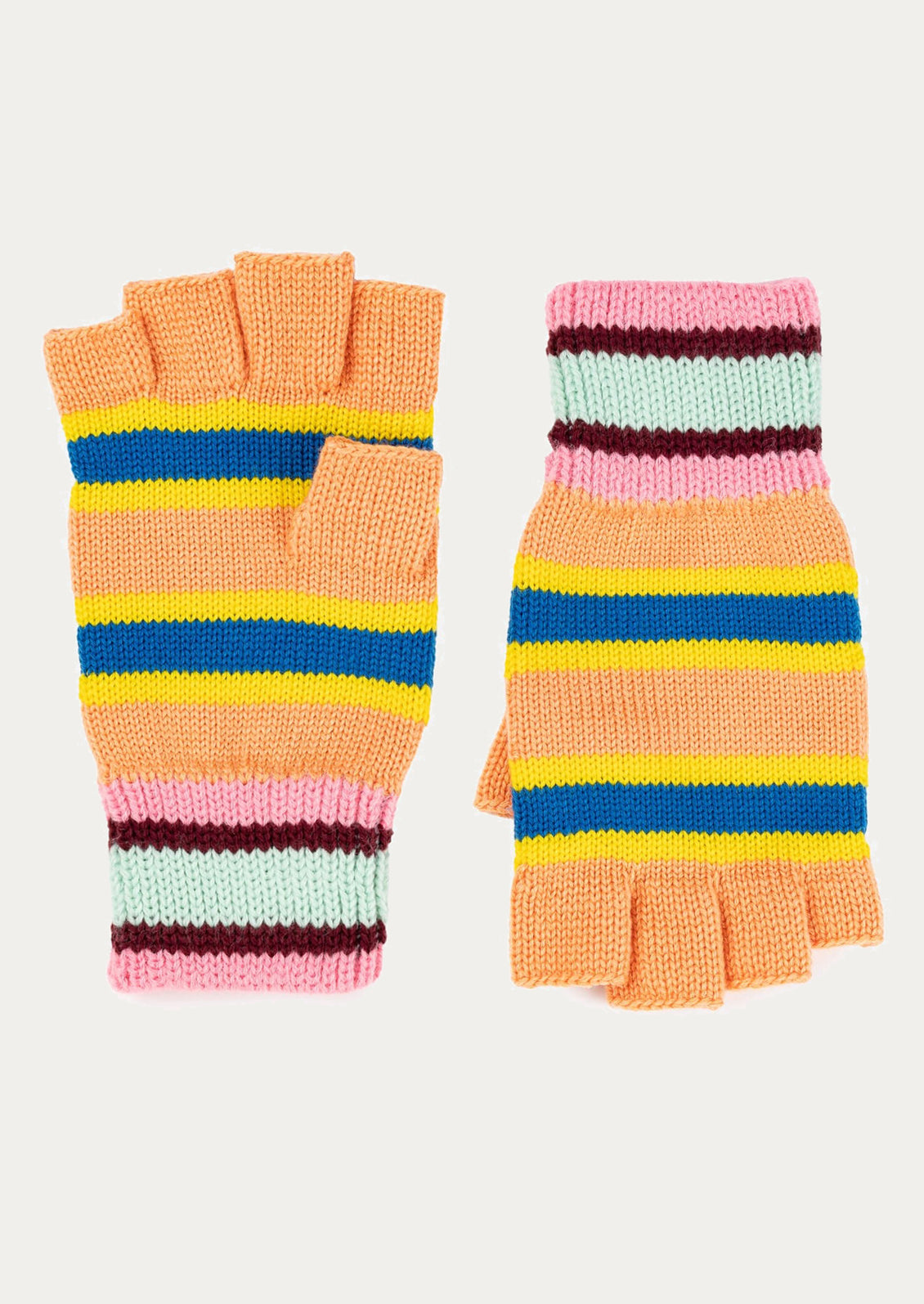 Pair of colorful striped fingerless gloves on a light pink background