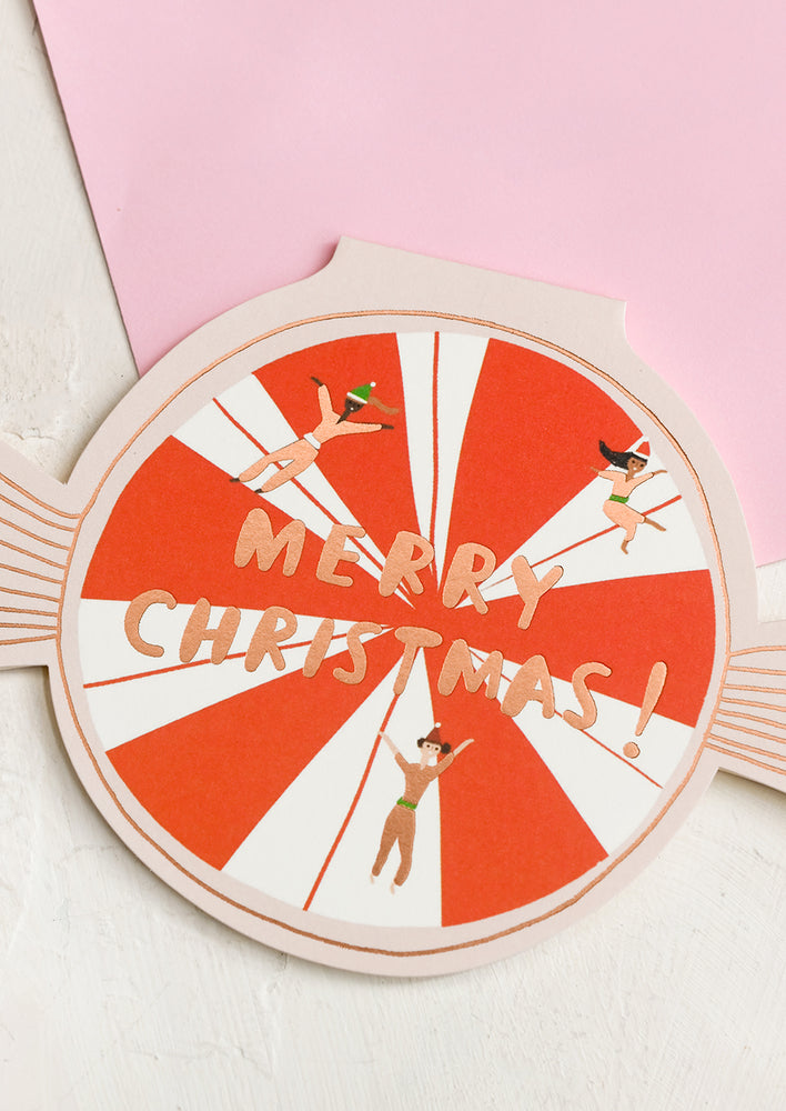 A card shaped like a piece of candy reading "Merry Christmas!".