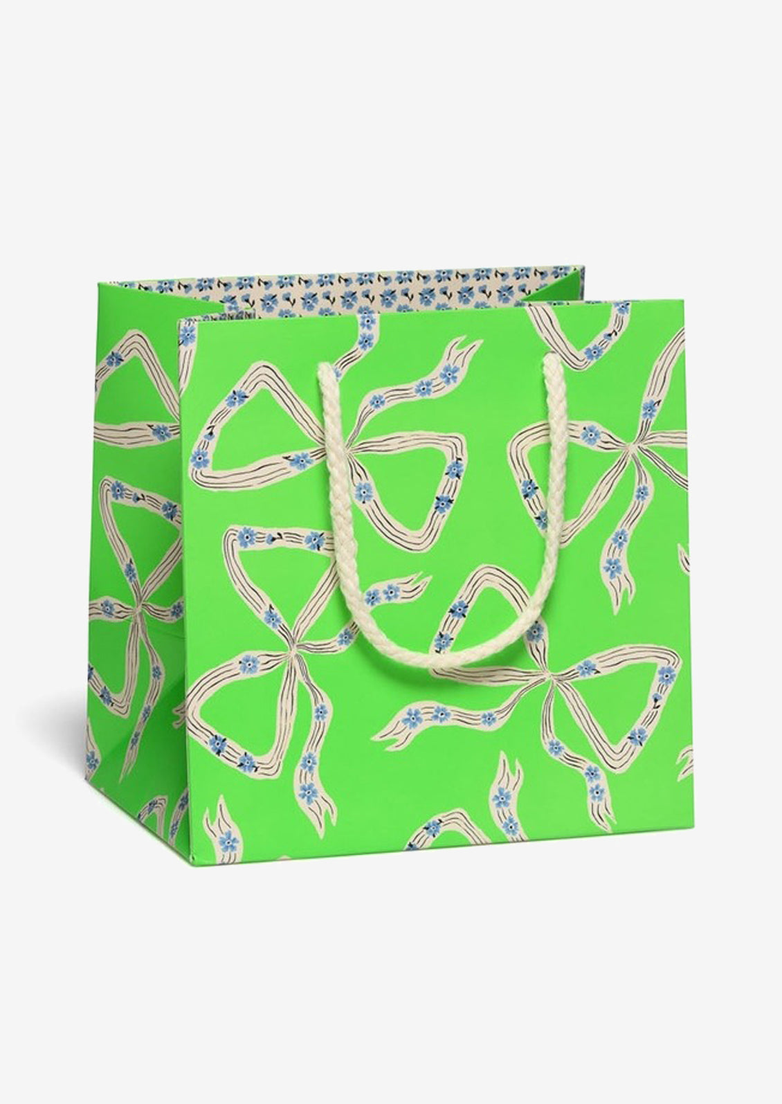 Green gift bag with bow pattern on a white background