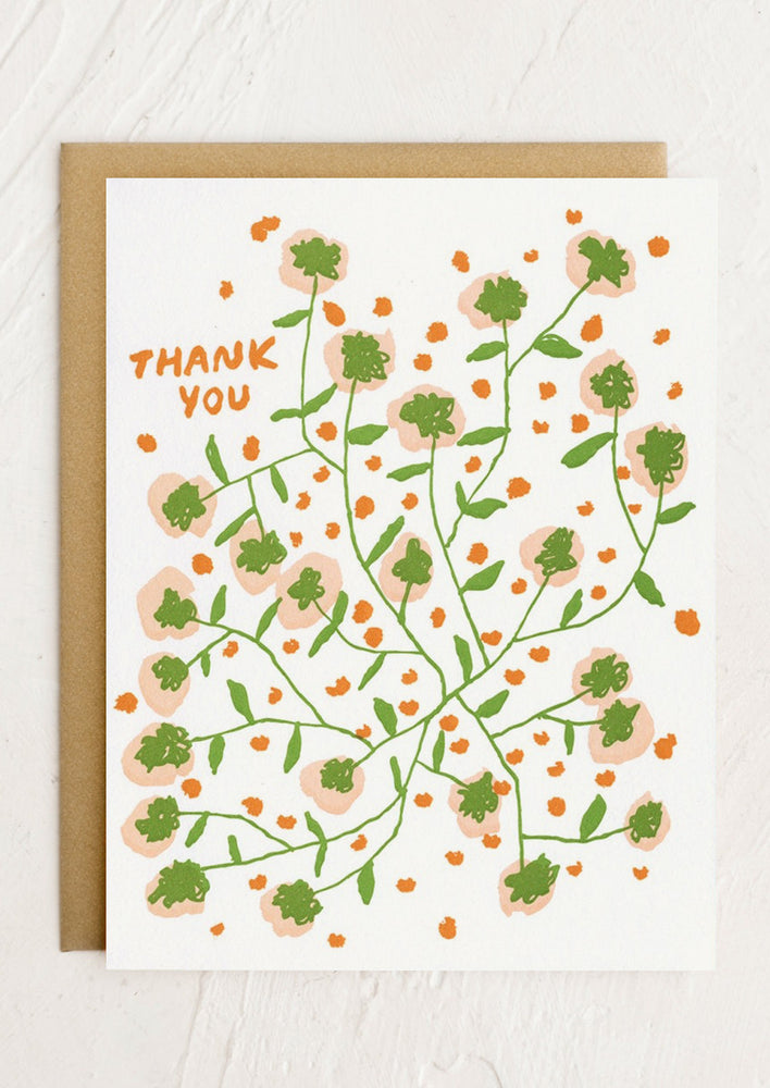 A floral print card reading "THANK YOU".