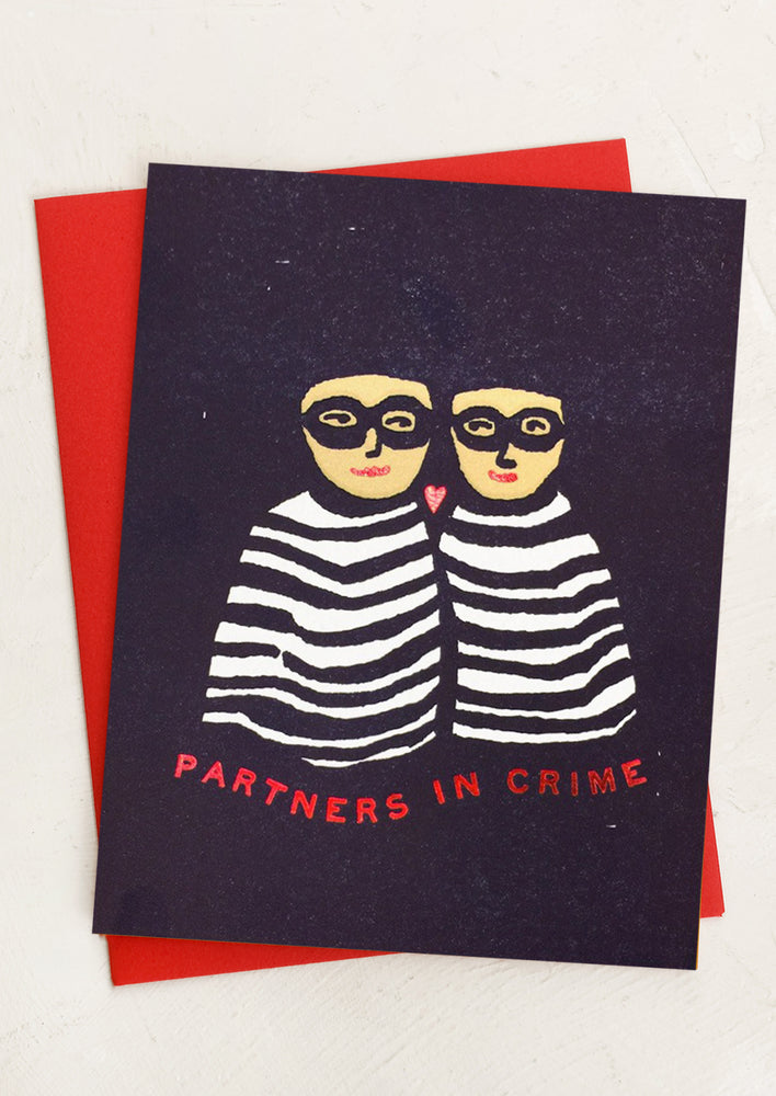 A card with illustration of two people in bandit costumes, text reads "Partners in crime".