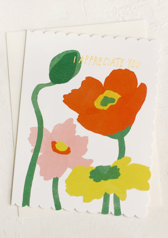A greeting card with image of poppies and text reading "I Appreciate you".