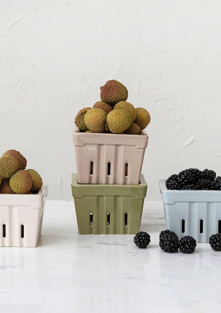 Ceramic berry baskets in a mix of pastel colors.