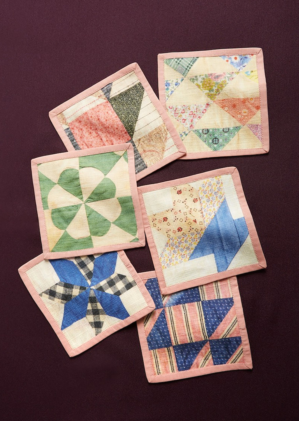 1: A set of quilt printed square cocktail napkins in 6 different patterns.