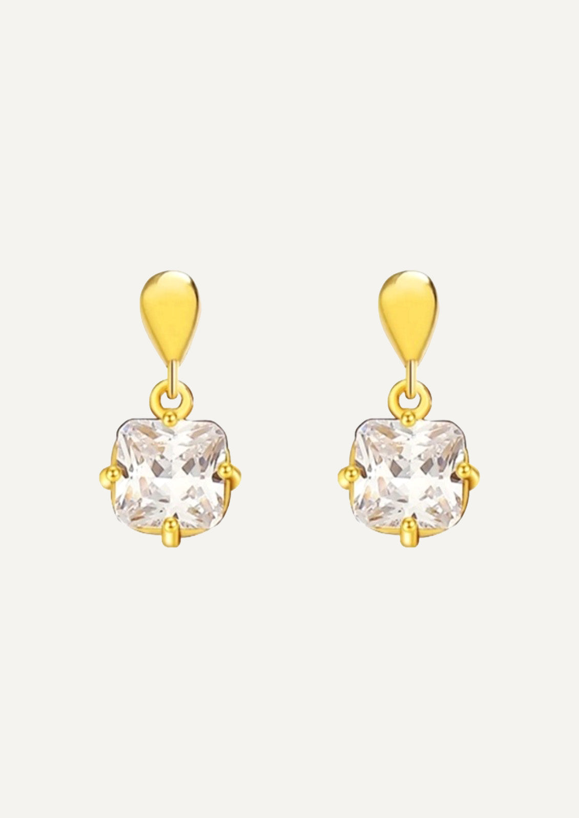 A pair of gold earrings with a princess cut cubic zirconia.