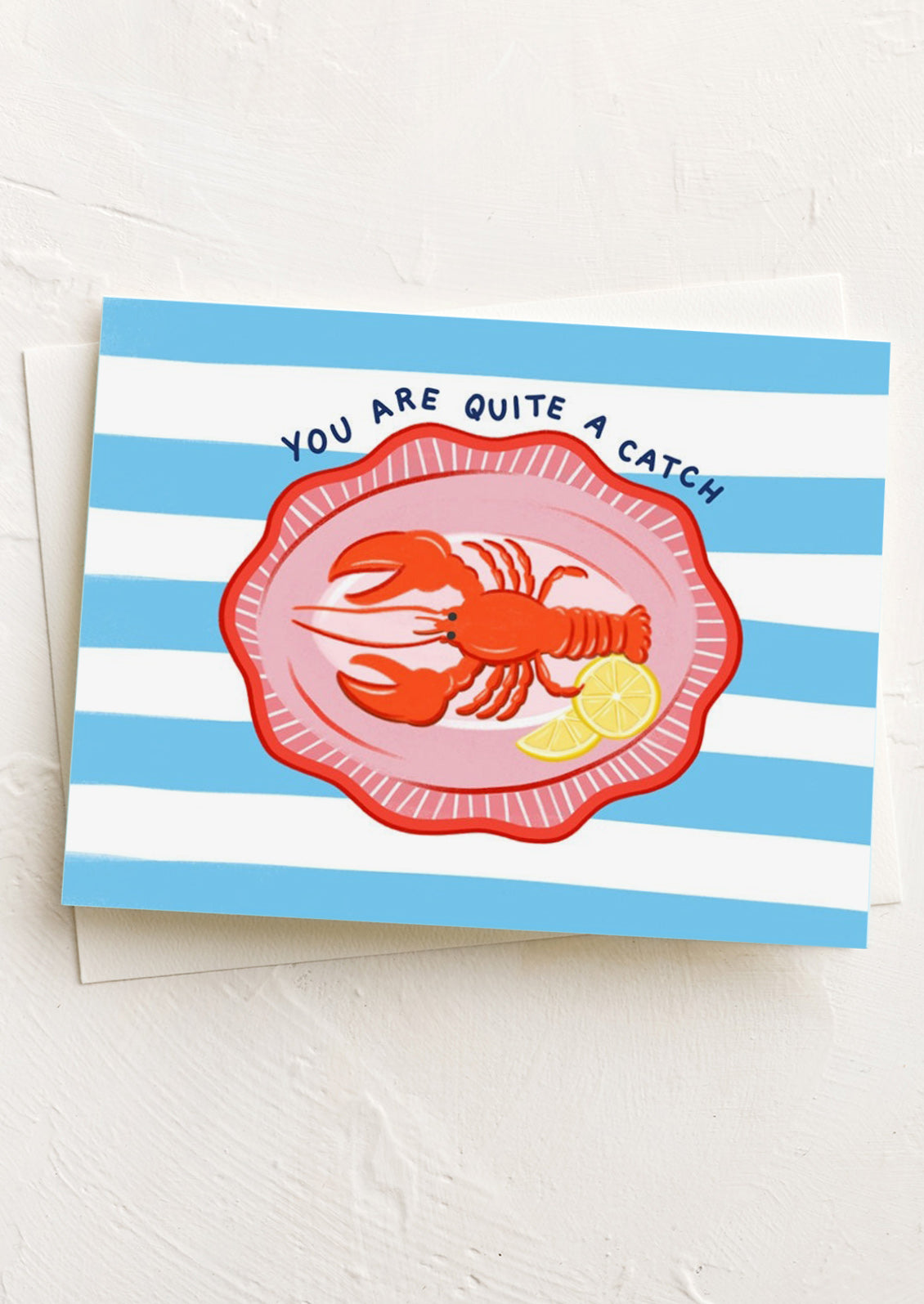 Greeting card with a lobster illustration and 'You are quite a catch' text on a striped background