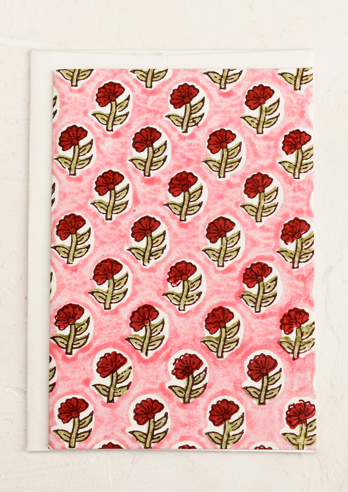 A block print card with pink and red floral.