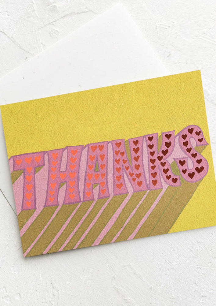 A card with retro font reading "THANKS".
