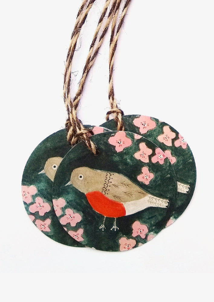 A set of round printed robin gift tags with two tone twine.
