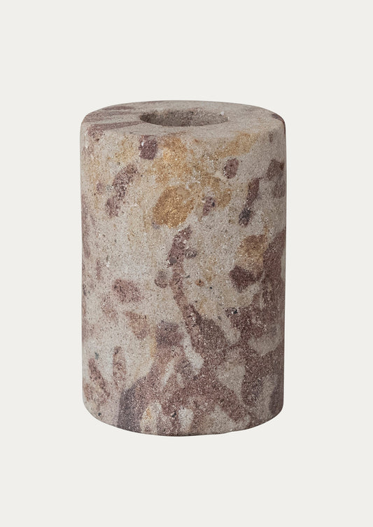 Cylindrical stone taper holder with natural patterns on a white background