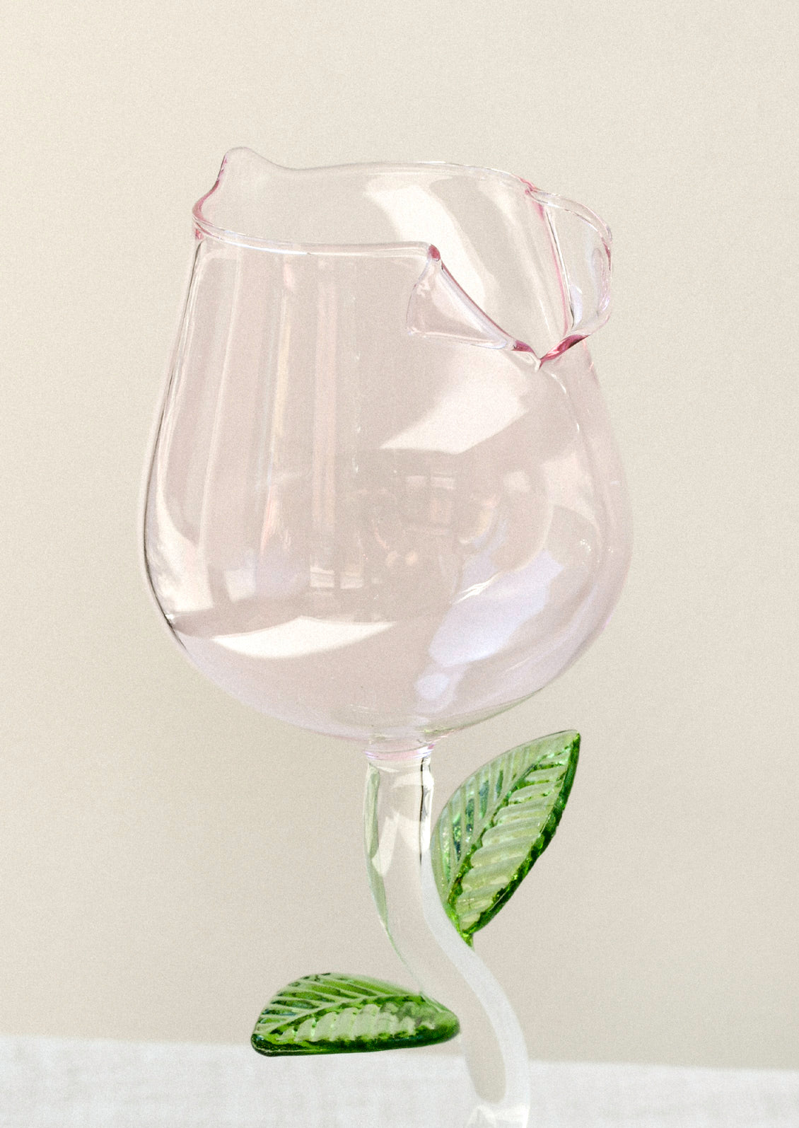 A wine glass in the shape of a rose.