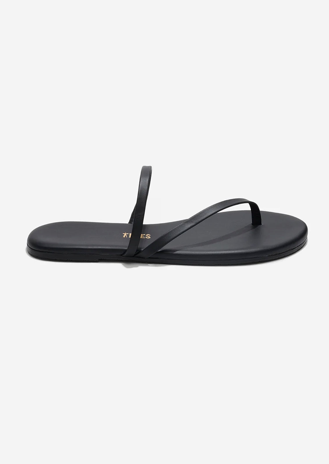 A black leather strappy sandal by TKEES.