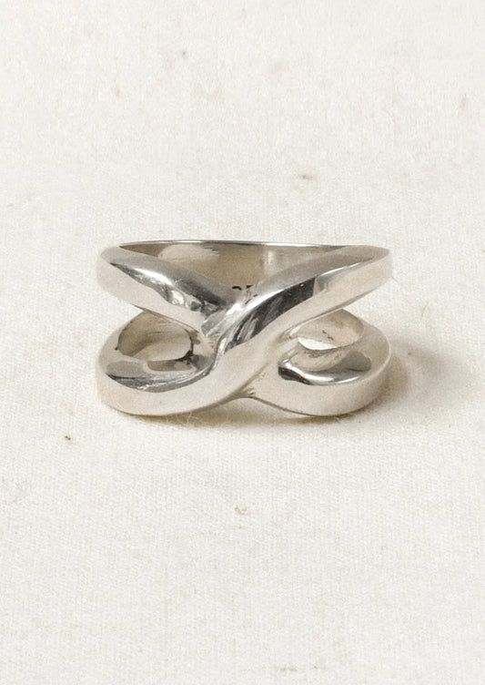 A chunky sterling silver ring with a knot-like design.