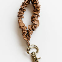 Brown Leather: A brown leather scrunchie keychain.