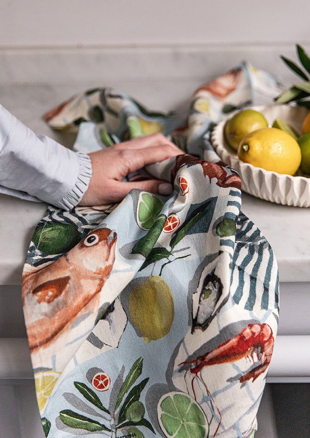 Seafood & Citrus: A printed linen tea towel with fish and citrus print.