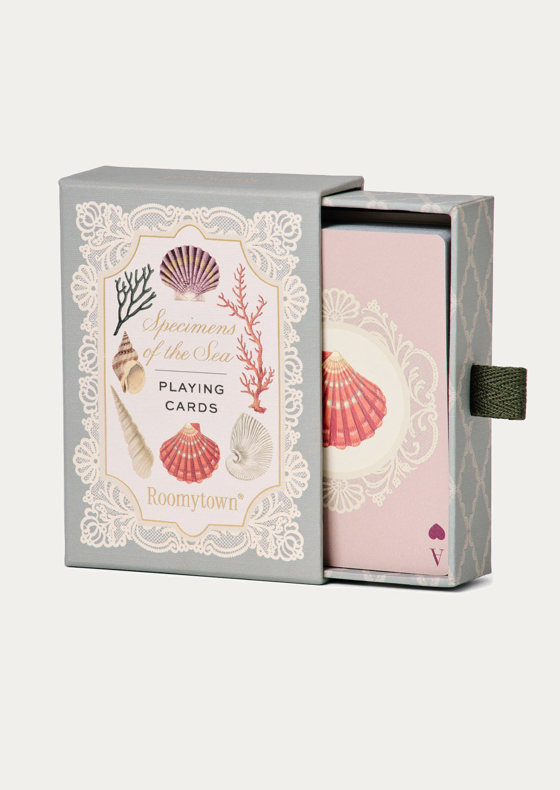 Playing cards with seashell design packaging on a white background