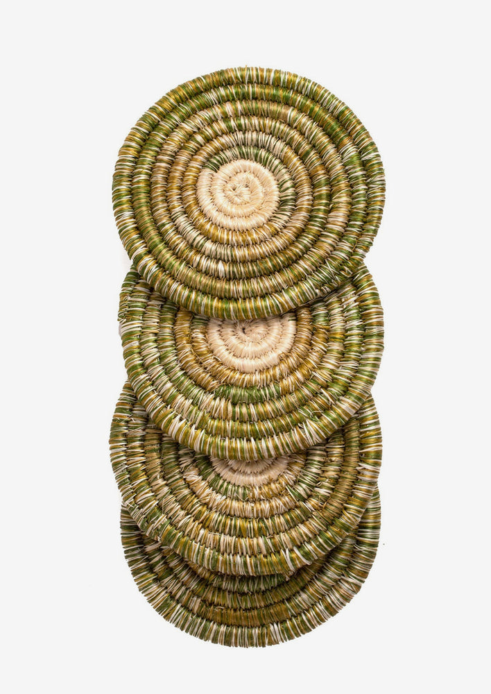A set of four sweetgrass coasters in variegated green.