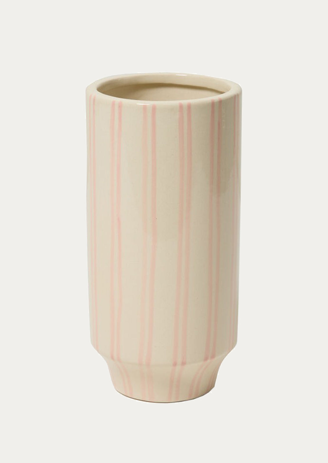 Ceramic vase with pink vertical stripes on a white background