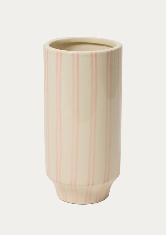 Ceramic vase with pink vertical stripes on a white background