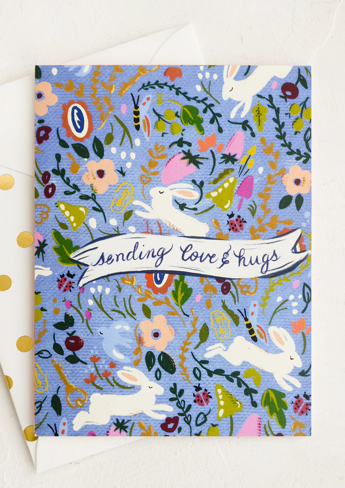 1: A bunny print card reading sending love & hugs.