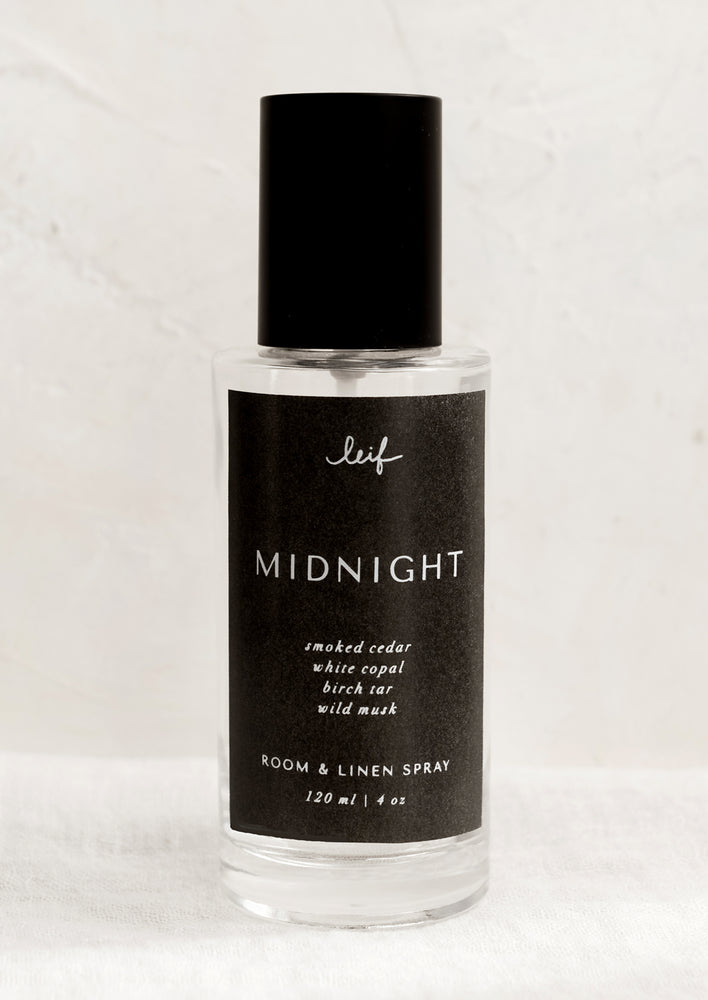 Midnight: A room spray bottle with printed text on black label.