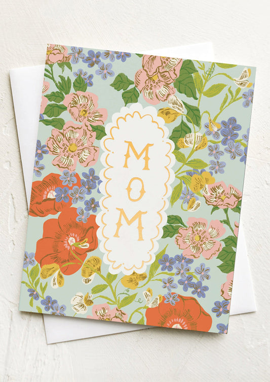 Floral card with 'MOM' text on a white background