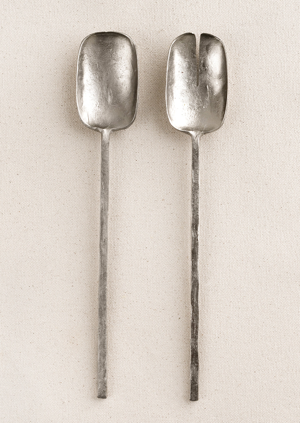 Pewter: Two piece salad serving set in a primitive silhouette, made in natural unpolished pewter finish.