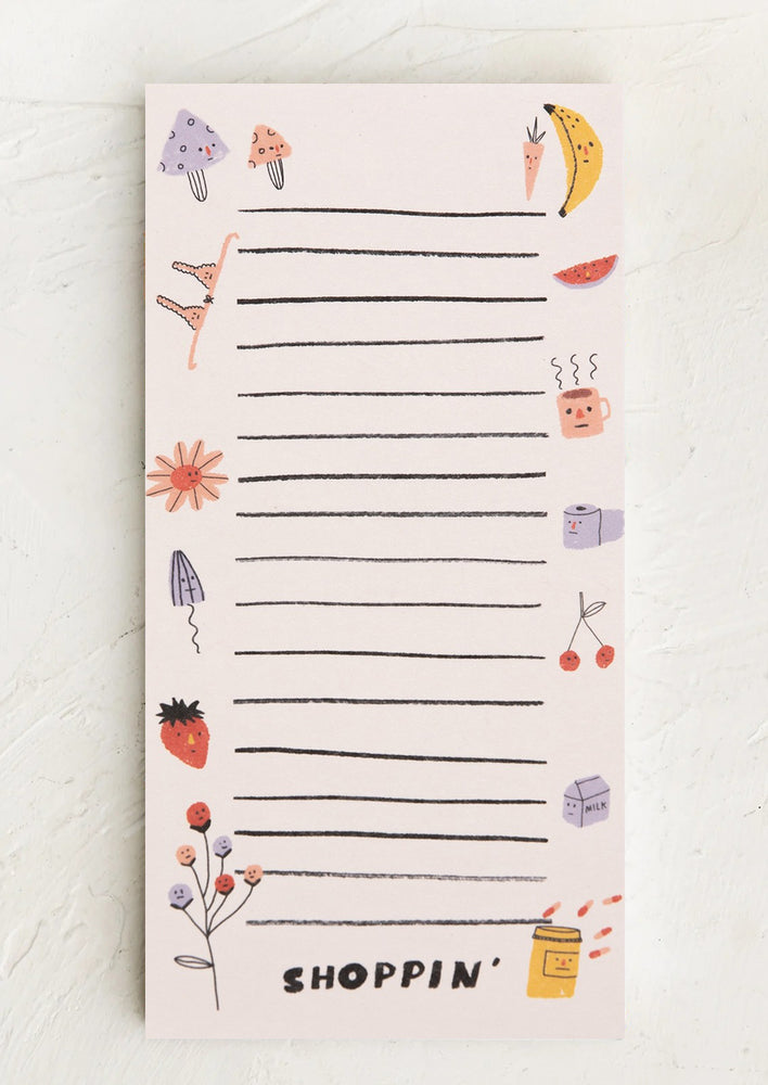 A list notepad that reads "shoppin'".