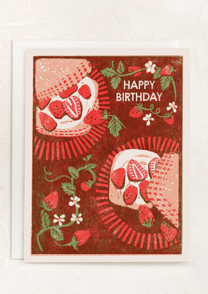 A strawberry shortcake illustrated birthday card.