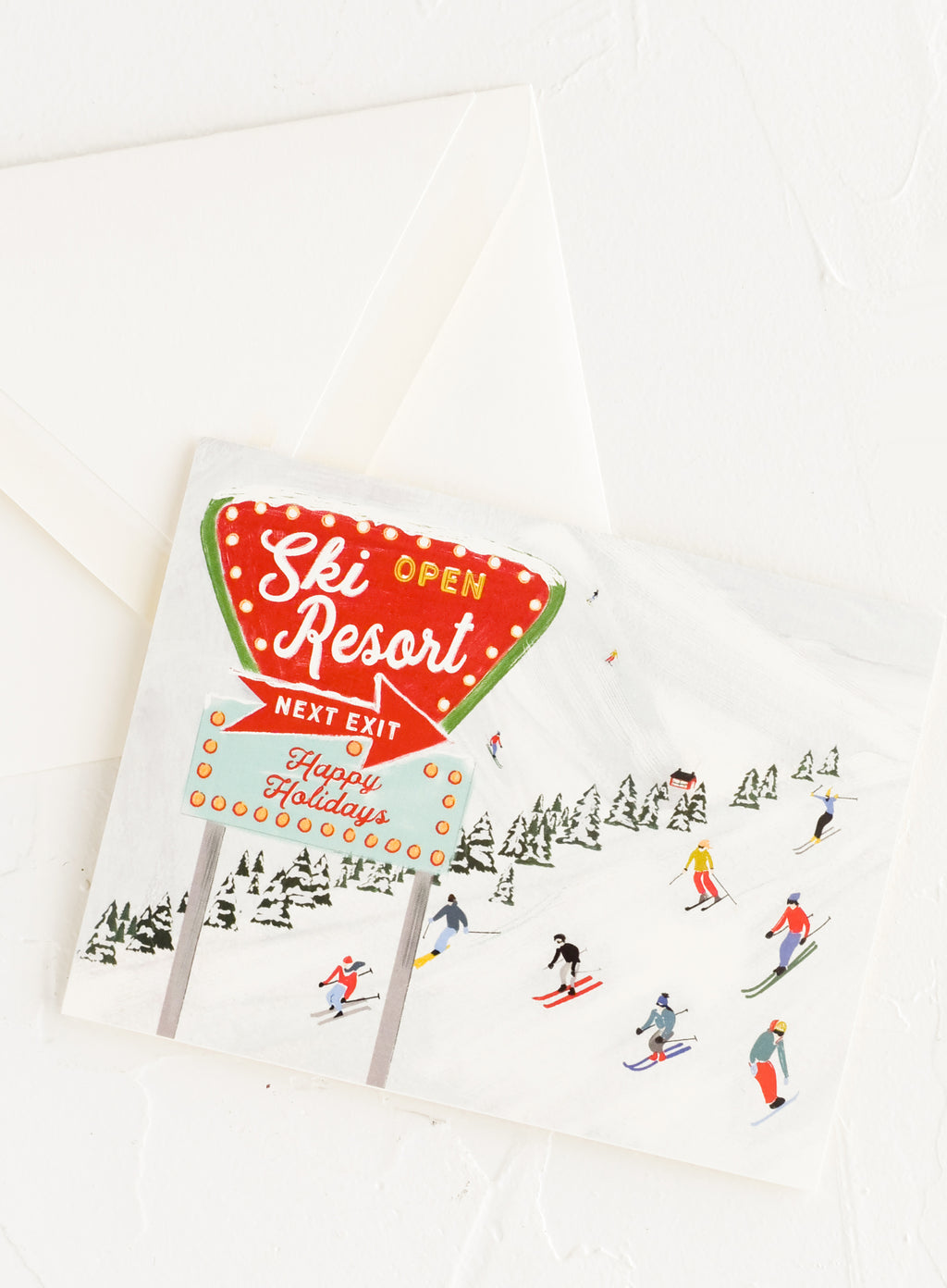 2: An illustrated greeting card with image of skiers on a hill.