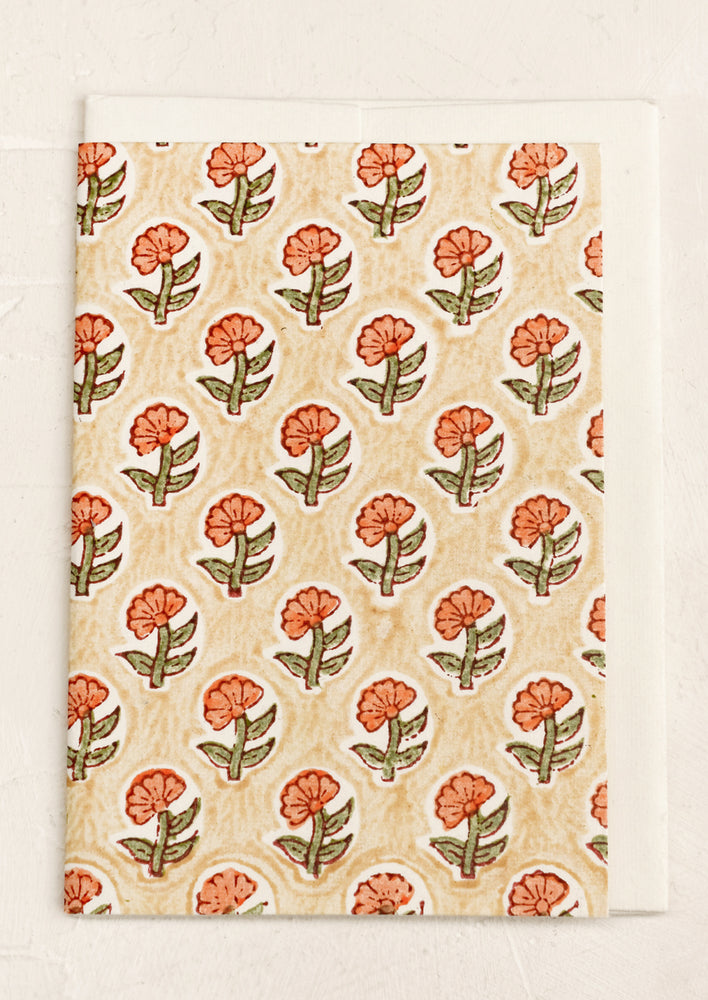 A block print card with peach and beige floral.