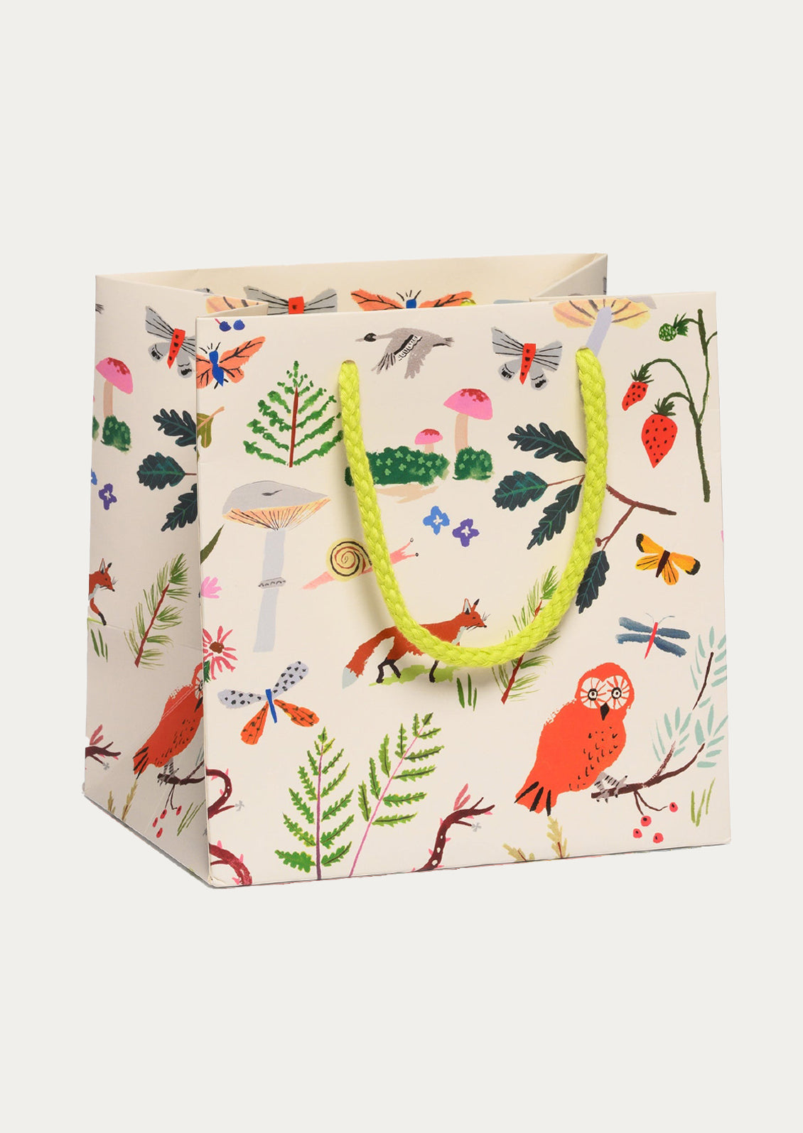 Patterned gift bag with colorful flowers and animals on a white background.