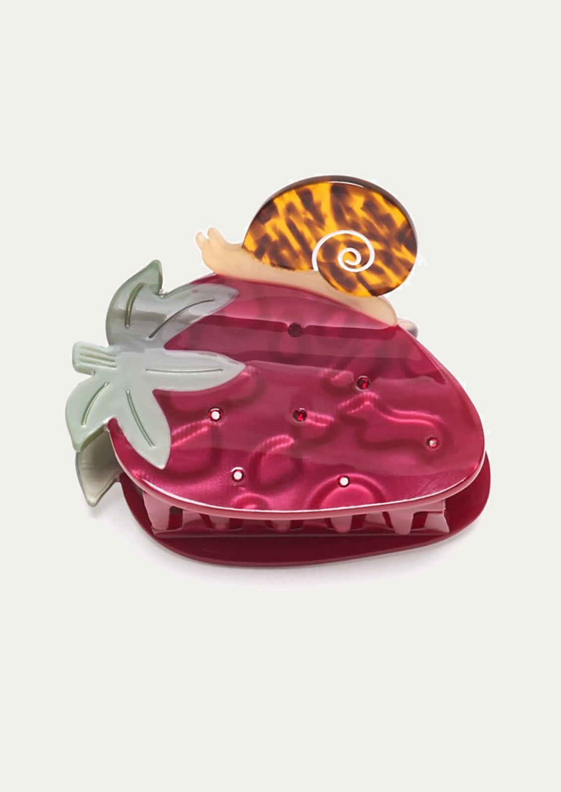 A strawberry shaped hair claw with snail detail.