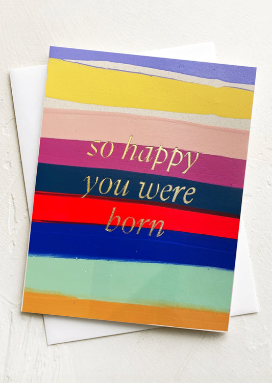 A rainbow stripe card, text reads "So happy you were born".