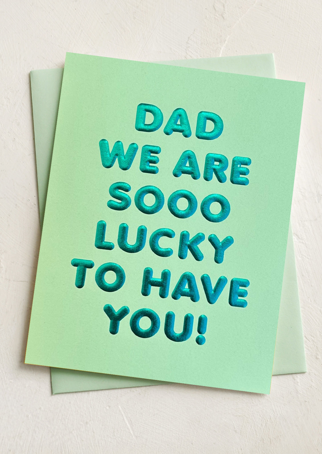A card reading "Dad we are sooo lucky to have you!".