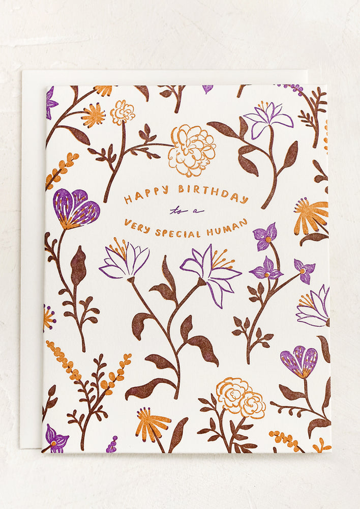 1: A brown and purple floral print card reading 'Happy birthday to a very special human".