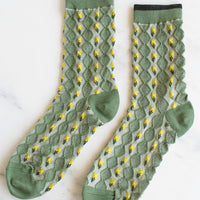 Sage Green Multi: A pair of green socks with yellow flower vertical lines.
