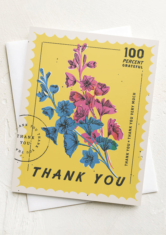 Greeting card with floral design and 'Thank You' text on a yellow background