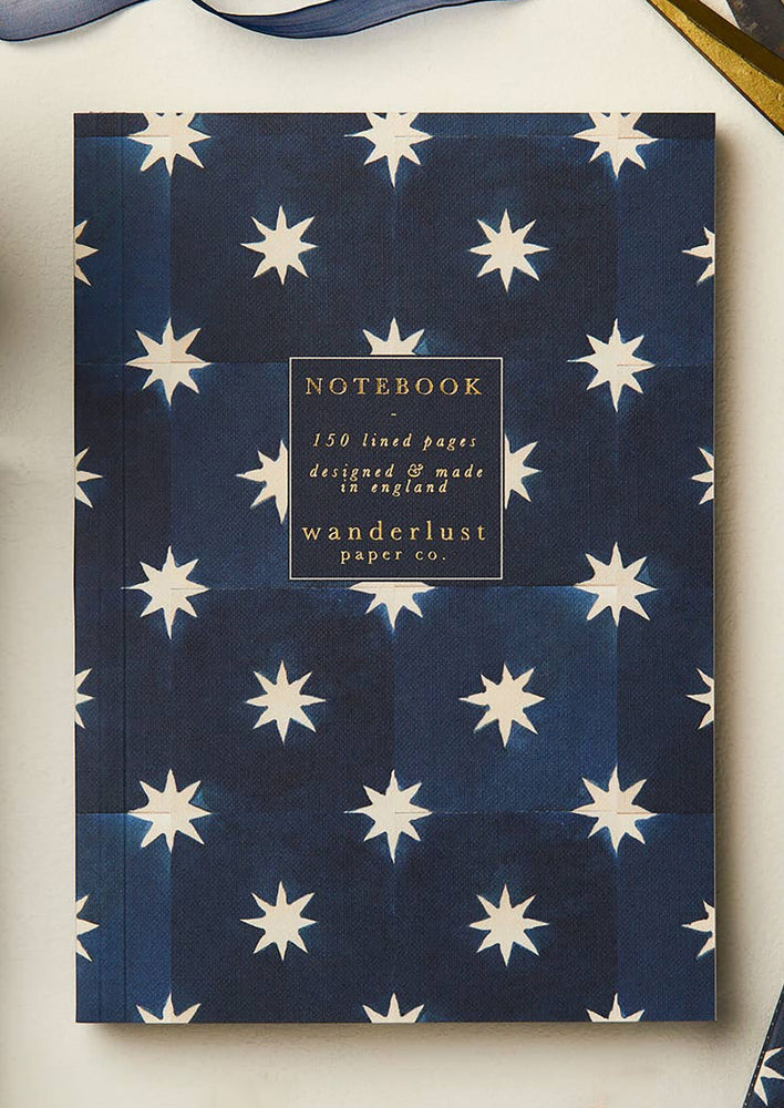Indigo Star: A navy and star floral print notebook.