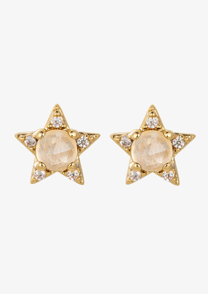 A pair of star shaped earrings with moonstone center.
