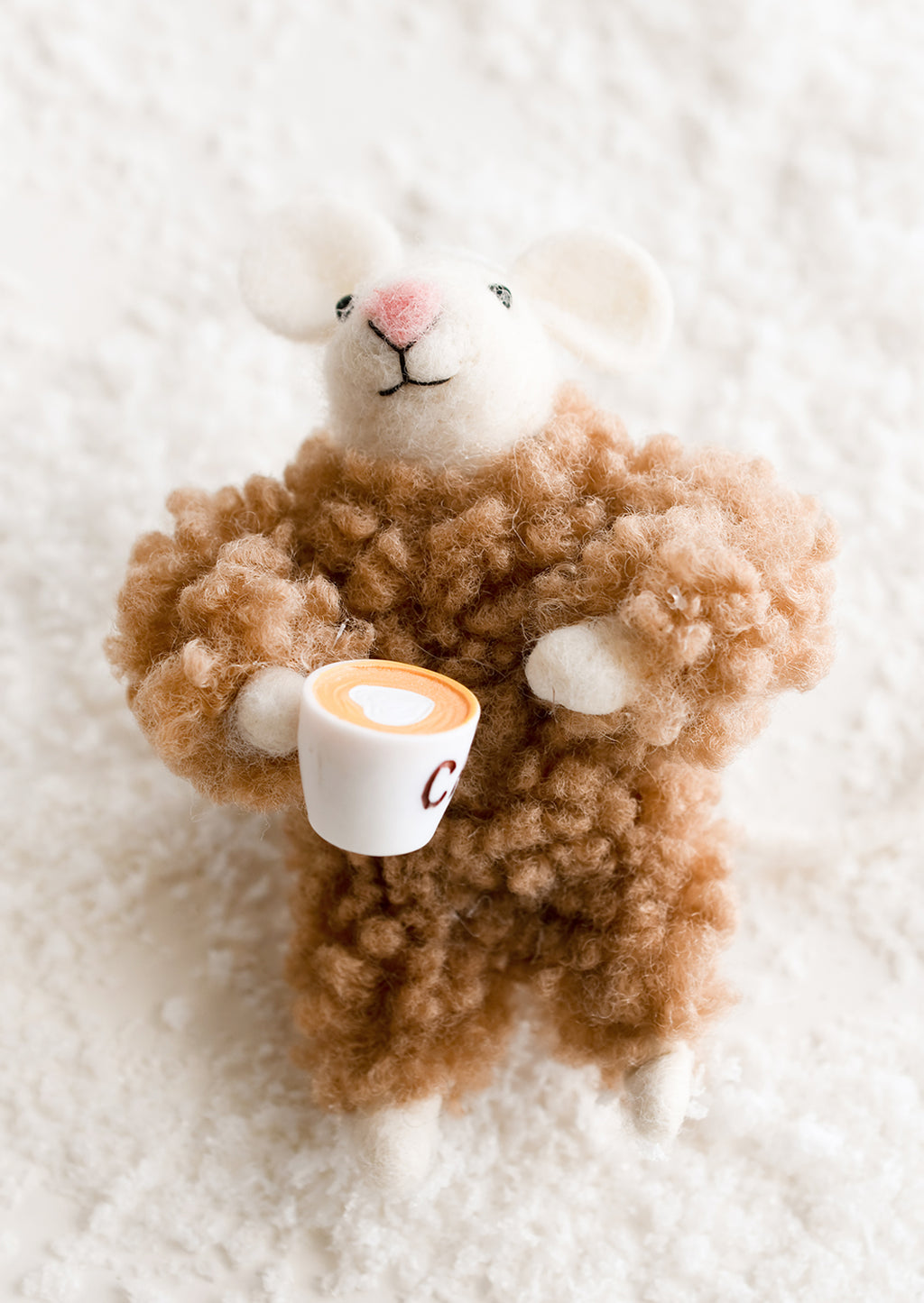 Coffee: A felted mouse ornament in brown fuzzy pajamas, holding cup of coffee.