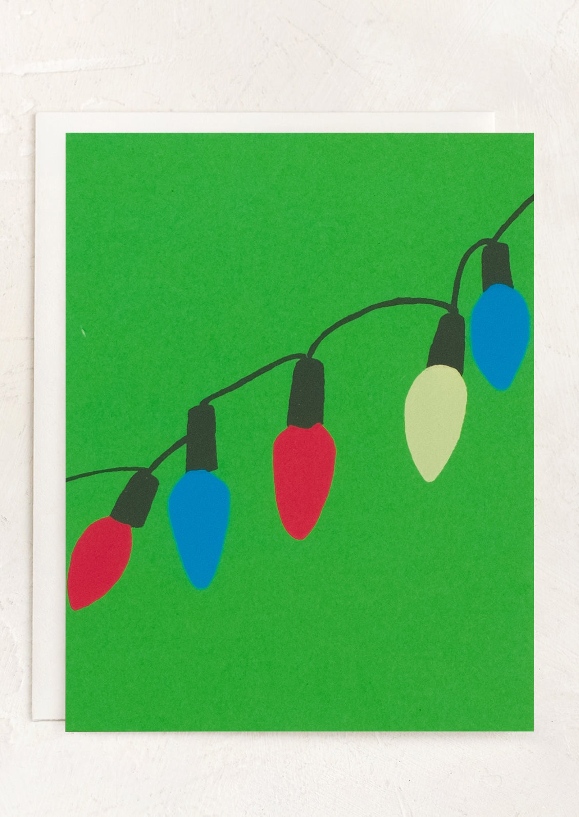 A greeting card with green background and printed string of holiday lights illustration.