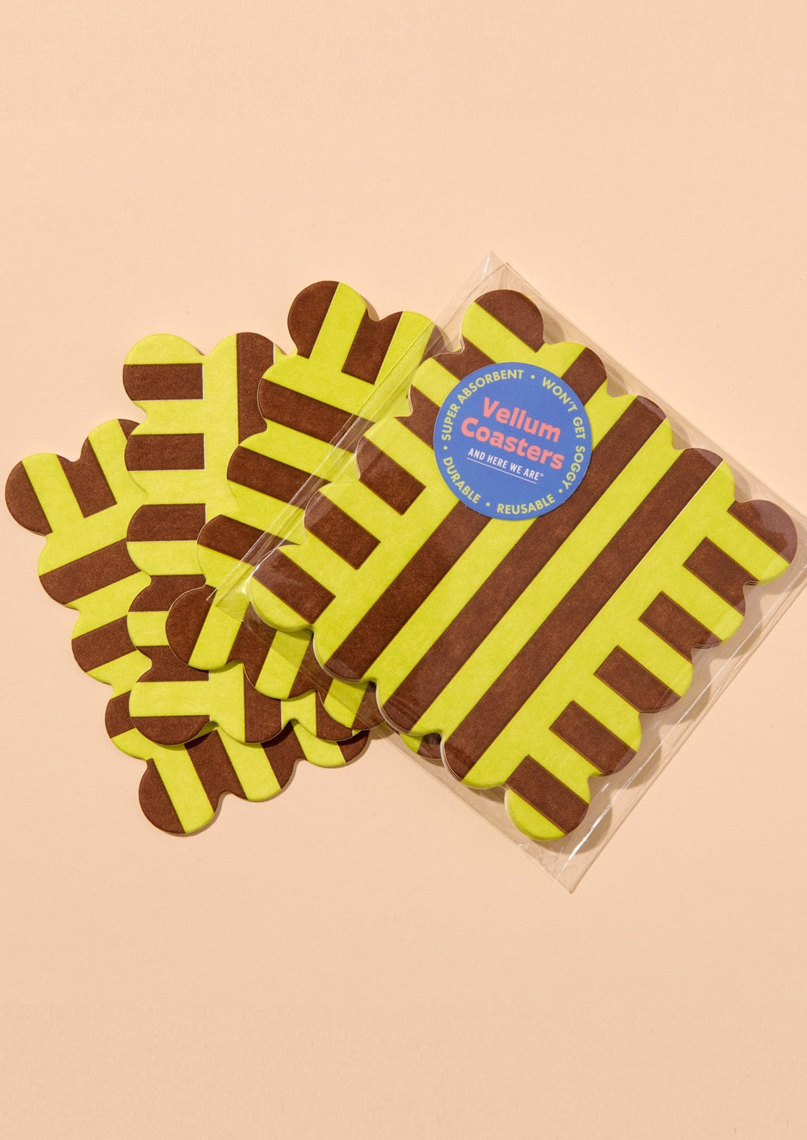 Packaged coasters with yellow and brown striped pattern on a beige background
