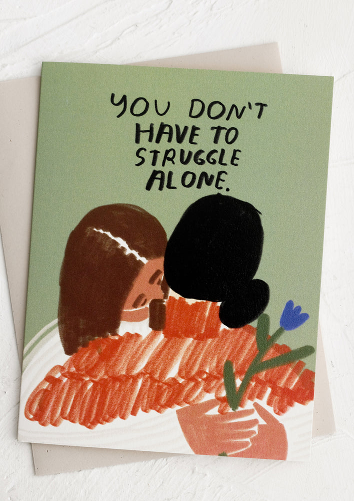 A greeting card that reads "You don't have to struggle alone".